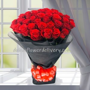 50 red roses with black wrapping delivery Dubai