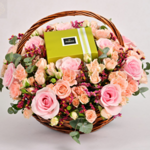 Pink flowers basket and chocolates