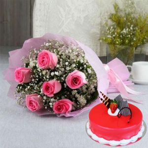 strawberry cake and pink roses